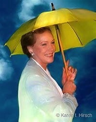 Julie Andrews holding up a yellow umbrella